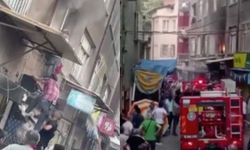 Alevlerin arasında kalan kadını mahalleli kurtardı
