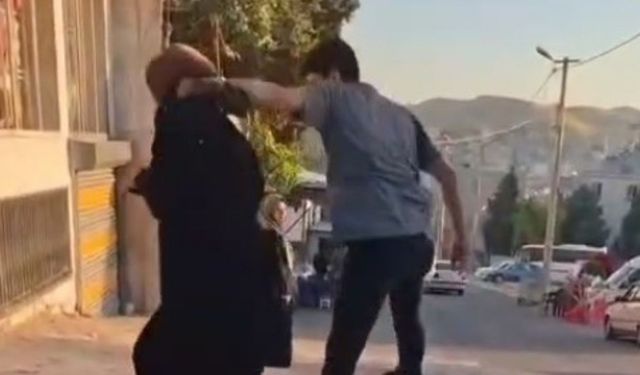 Sokak ortasında eşini darp etti, tepki gösterenlere çıkıştı
